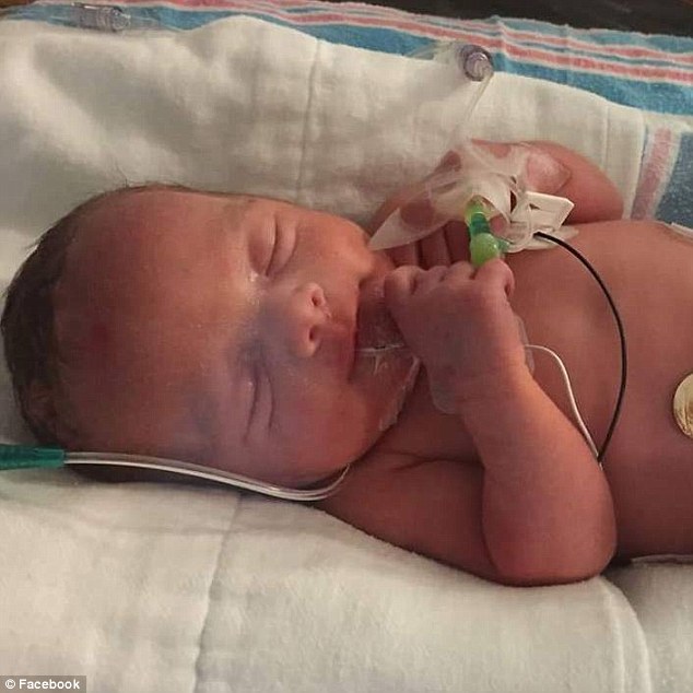 Emmaleigh is seen above in a Facebook photo shortly after she was born. As of Thursday a Go Fund Me page has raised $20,000 for her funeral and medical expenses