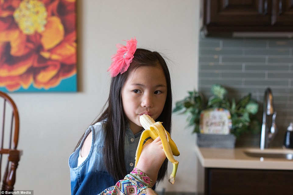 Sophi, pictured, was adopted from China by her parents Jeremy and Christianne along with her sister Lexi