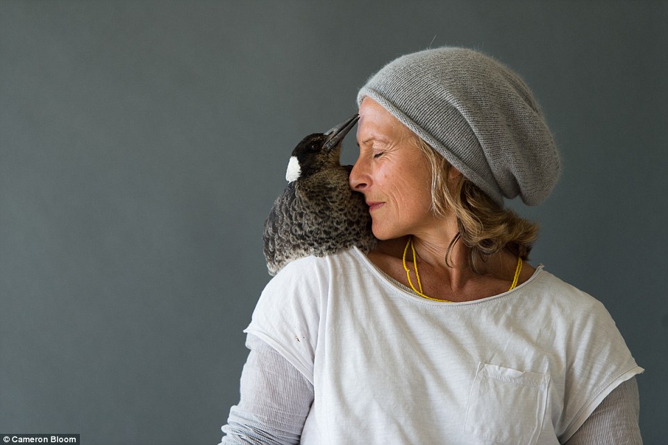 Their feathered friend dropped into their lives at a dark and difficult time, when the photographer's wife Sam (pictured) became paralysed after falling from a balcony in Thailand while on holiday