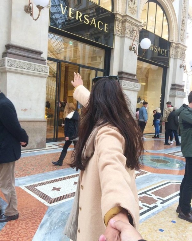 Lyndem, inspired by the #FollowMeTo series, had the idea to pose in front of luxury stores in Milan as a joke.