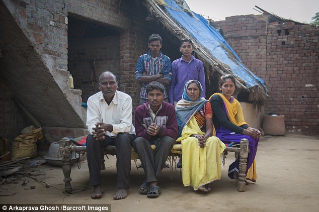 Arun (pictured, second from the left) sits in between father Sri Ram Singh, 55), and his mother Kokla Devi , 50. His sister Aarti (extreme right) and his two brothers Lal Bahadur (back left) and Sudeer (back right) have rallied round him over the years