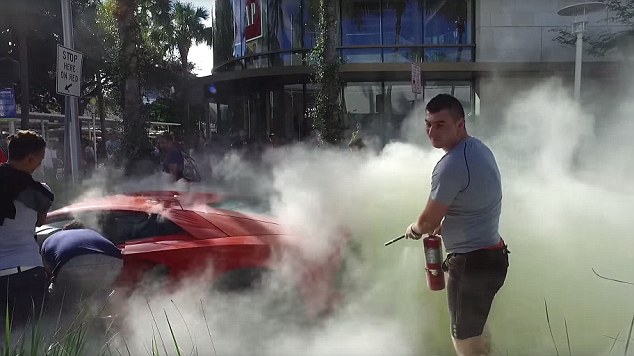 To the rescue! A passerby managed to grab a fire extinguisher and douse the flames with carbon dioxide