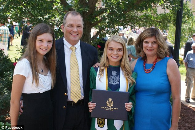 New hope: A scholarship was created in Emily’s name at Harrison High School, where she was an honor student and varsity cheerleader. Here she poses with family at her high school graduation 