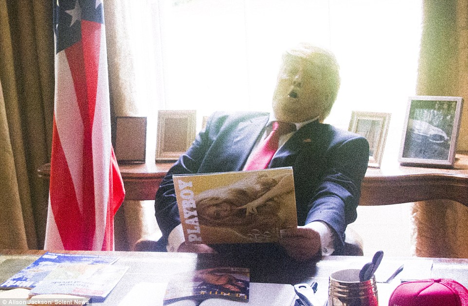 One of Alison Jackson's photos shows a Donald lookalike reading a playboy magazine in the Oval Office