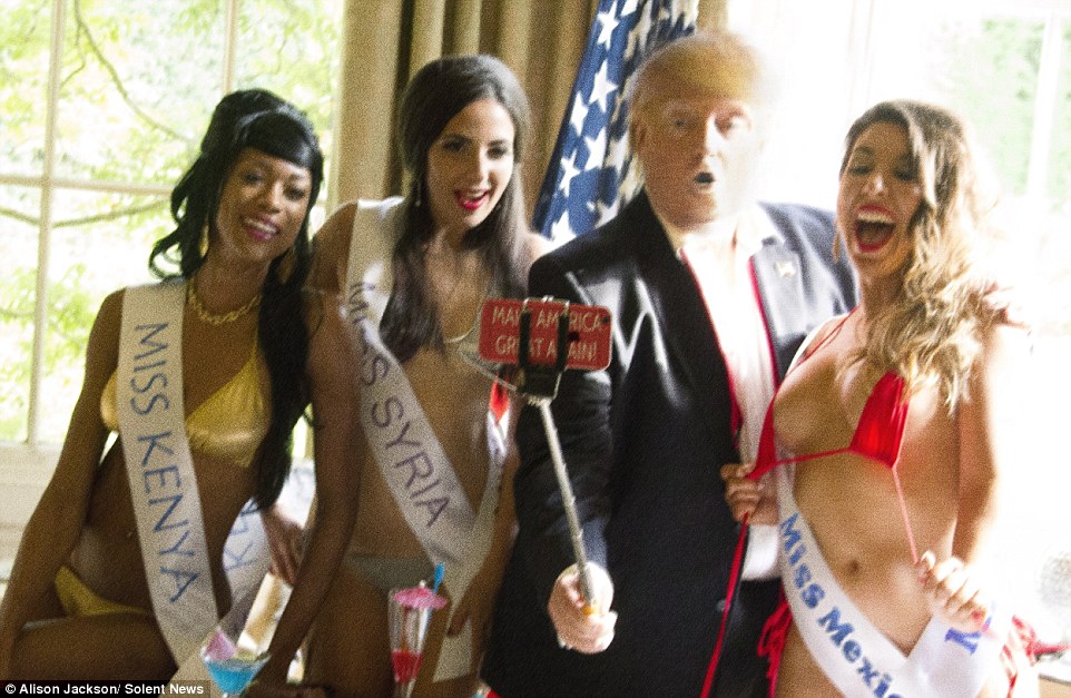 The impression shows lookalikes posing for selfies with world models with a 'make America great again' phone case