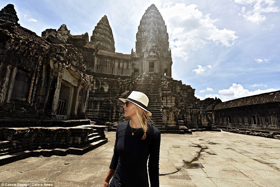 Soaking it all in: Cassie says although she isn't the first documented woman to travel to every country in the world, she imagines that the 'feeling of accomplishment and awe will be overwhelming'. Pictured above at Angkor Wat, Cambodia