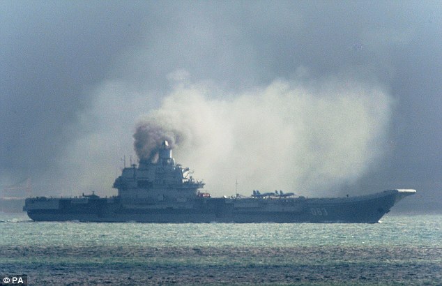 Intimidation: A Russian aircraft carrier, Admiral Kuznetsov, is part of the Russian military buildup that has convinced Nato to put 300,000 troops on alert. It was seen passing within a few miles of Dover on its way to reinforce the attack on the besieged city of Aleppo in Syria