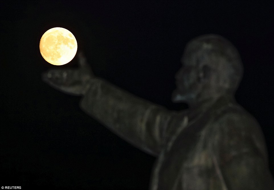 Another image captures the sense of history in the event with a giant statue of Soviet state founder Vladimir Lenin appearing to hold the orb in the palm of his hand in Baikonur, Kazakhstan