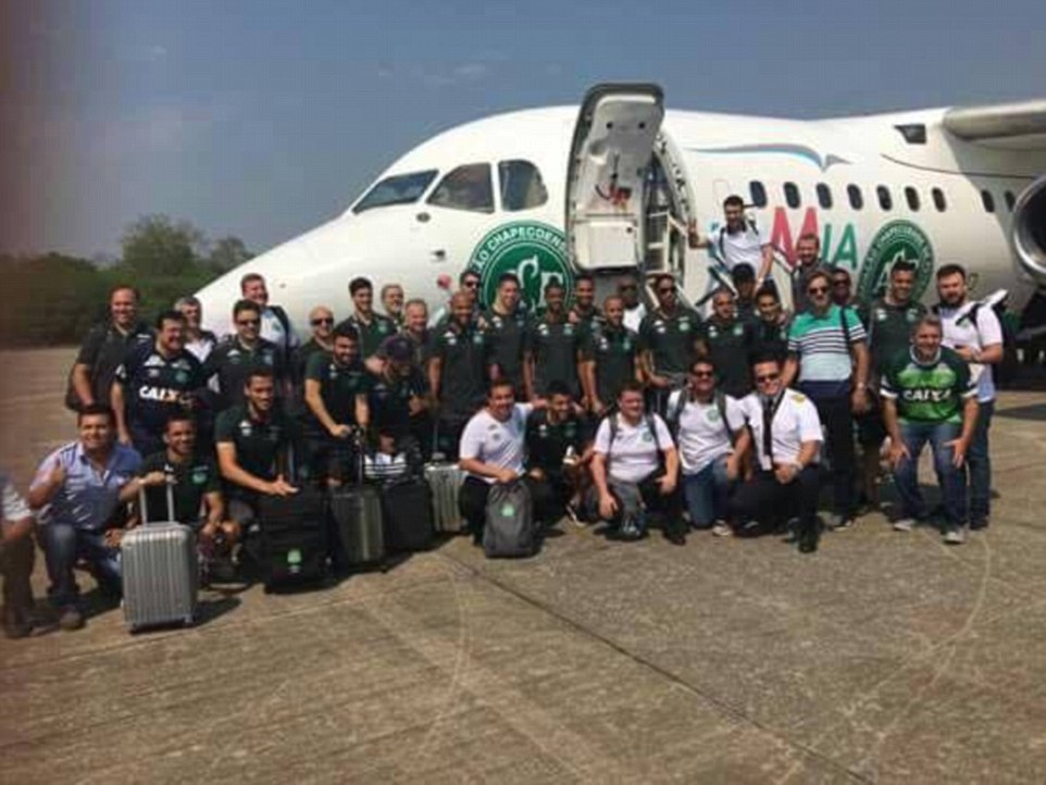 Players and staff of the Chapecoense team pose for a photograph in front of the plane before their fateful flight