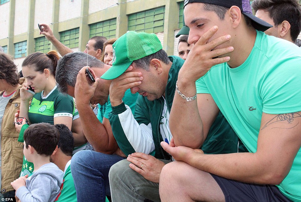 Grieving Chapecoense fans pictured outside the club's stadium as the true scale of the disaster unfolded on Tuesday