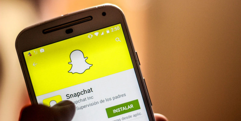 The application of Snapchat 2015 on a cellphone scrolling