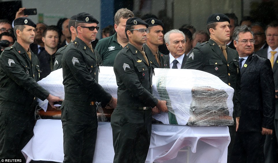 Brazilian president Michel Temer received Thiaguinho's coffin as it was taken off the aircraft after arriving in Chapeco 