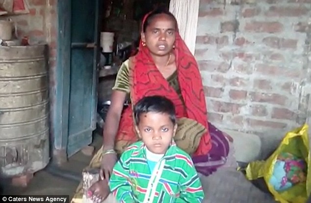 Manjhri Devi, pictured with one of the couple's sons, has hit out at her husband after he cut off his own manhood