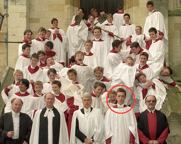 Praiseworthy: A young Eddie Redmayne keeps a straight face as fellow choristers cavort behind him