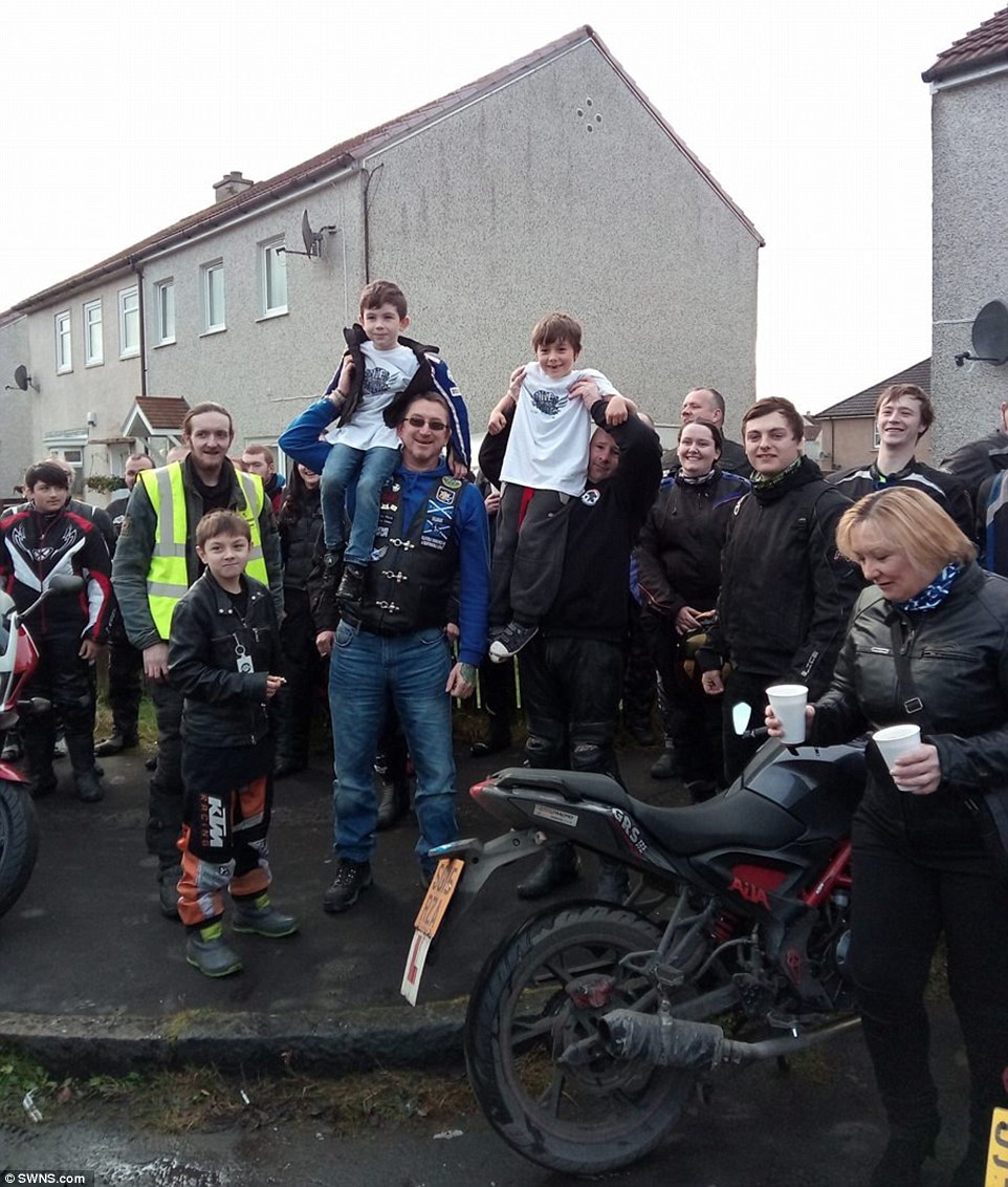 Support: Bikers help cheer up Darren (right) and Connor (left) in Larkhall, South Lanarkshire after the vicious attack