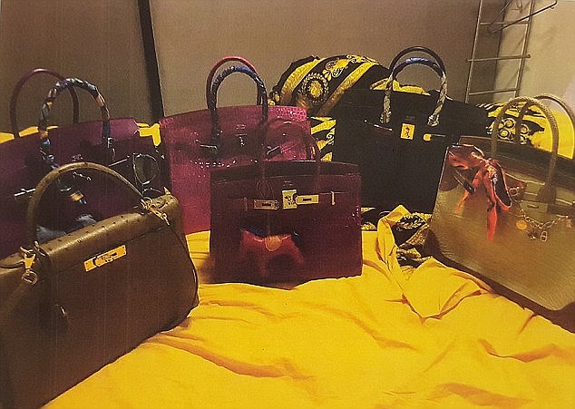 Some of the handbags seized from Ms Lee's apartment were by designer brand Hermes (centre two and two at right)