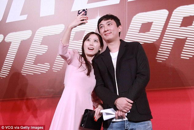 Wang Jianlin addressed a summit on entrepreneurs over the weekend. His son is pictured with fans in February last year
