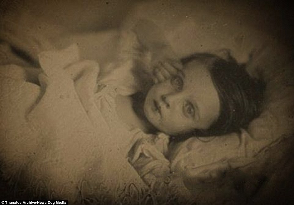 This heartbreaking photograph of a young girl, was taken in 1850. The youngster's arm has been posed and her eyes have somehow been propped open to give the illusion that she is still alive