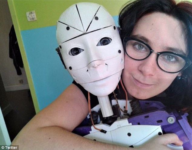 Proud: Lilly, from France, is in a relationship with a robot she 3D-printed herself (pictured)