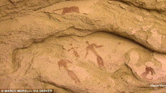 The reddish rock art found in a small cave within the Sahara desert, shows a mother and father stood over a newborn, with animals present and a star in the east