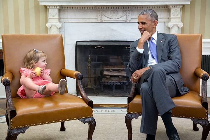 June 22, 2016: “The great thing about children is you just don’t know what they will do in the presence of the President. So when David Axelrod stopped by the Oval Office with one of his sons’ family, Axe’s granddaughter, Maelin, crawled onto the Vice President’s seat while the President continued his conversation with the adults. Then at one point, Maelin glanced over just as the President was looking back at her.”