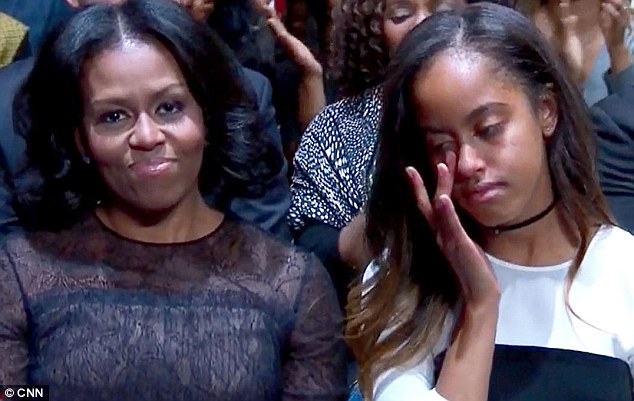 Michelle beamed and appeared to hold back tears whiles daughter Malia cried. Obama called the first lady a 'role model' for the country, as well as his 'best friend'