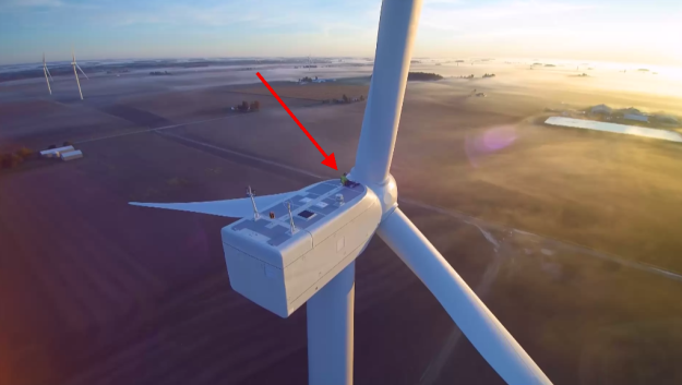 Look at this regular-sized man dwarfed by a larger-than-life wind turbine. Anything?
