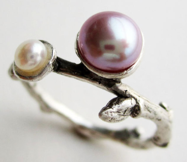 A pretty pink and white pearl ring with a look that branches off from the ordinary.