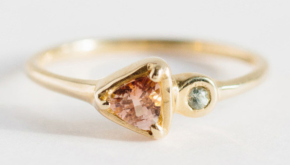 A sapphire and sunstone soleil ring that always points in the direction of true, everlasting love.