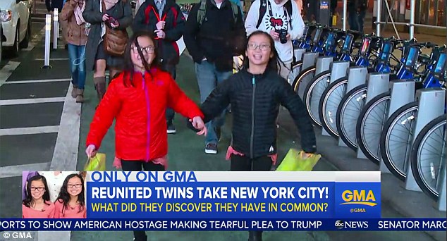 Twin sisters Gracie Rainsberry (right) and Audrey Doering (left) explored New York City together Wednesday after being reunited for the first time since being adopted from China