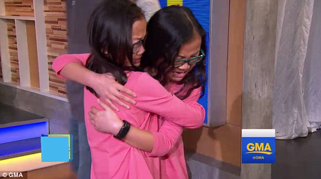 Reunited at last! Sisters Gracie (right) and Audrey (left) met for the first time in person Wednesday and exchanged a long-awaited hug on 'Good Morning America'