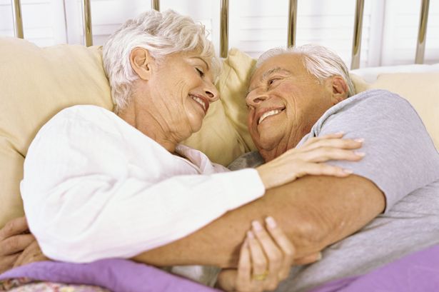 Senior couple lying on the bed