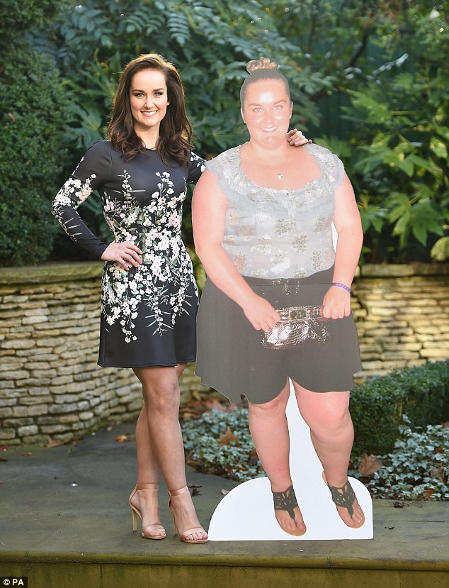 The super slimmer poses with and old cutout of herself