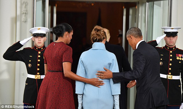 After meeting the Obama's, Trump barreled through the front door leaving Melania to be escorted by the former President and First Lady into the white house 