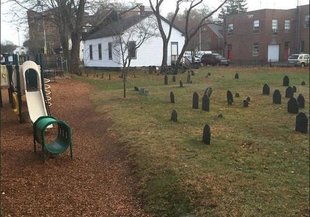 It's always unsettling to see a playground this close to a graveyard. 