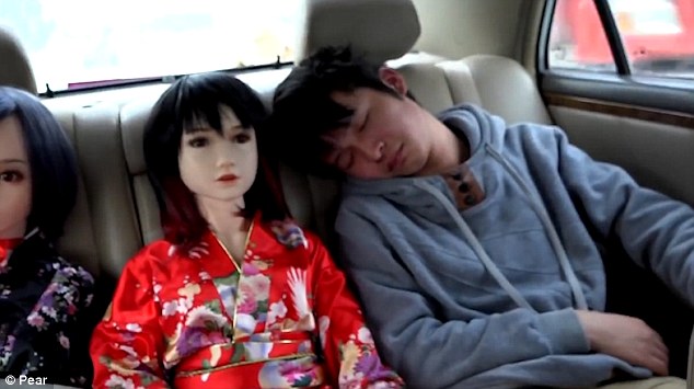When Li drives, he puts one doll on the passenger seat. His son sits with two others at the back