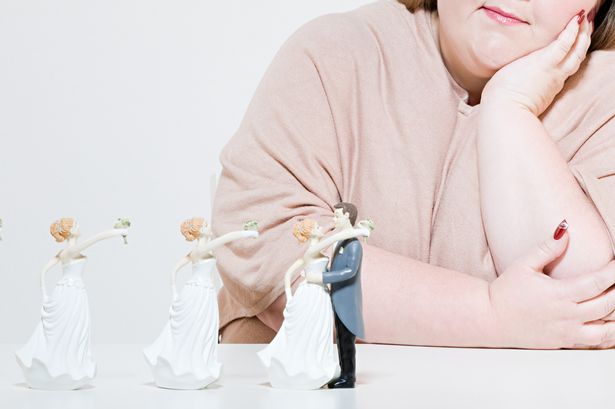 Woman and wedding figurines