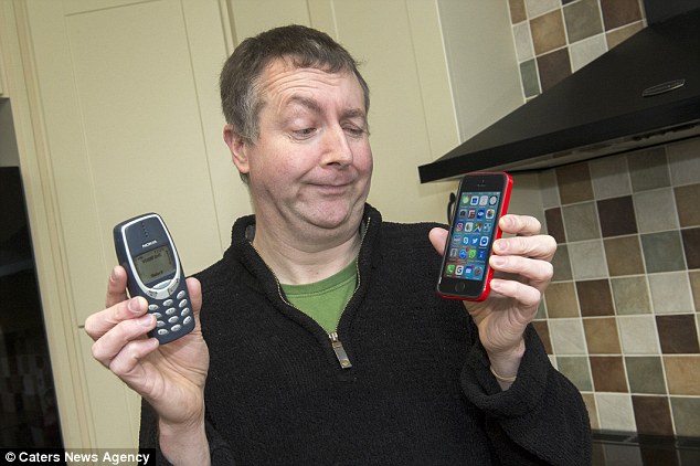 Comparison: Whereas as most people could not live without selfies and apps, Mr Mitchell admits he would be 'distraught' if he was forced to give up his old handset