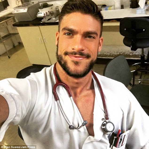 Hunky: Nurse Fran Suarez, from Madrid, Spain, has won thousands of Instagram followers with his sexy selfies. Some images show Mr Suarez with a stethoscope draped around his neck