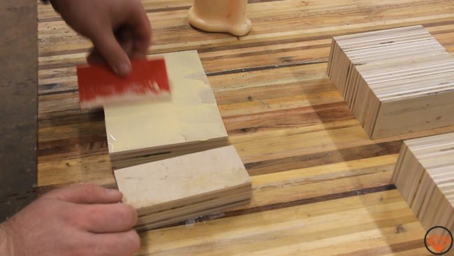 Wanting to achieve a stacked plywood look, he glued each cut of wood together.