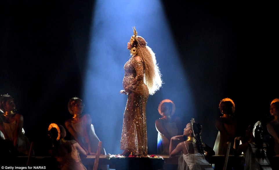 Under the spotlight: Beyonce showed off a long wig under her headdress 