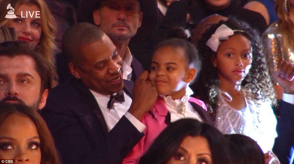 Meanwhile, sitting in the audience was her daughter Blue, who was on Jay Z's lap next to Solange