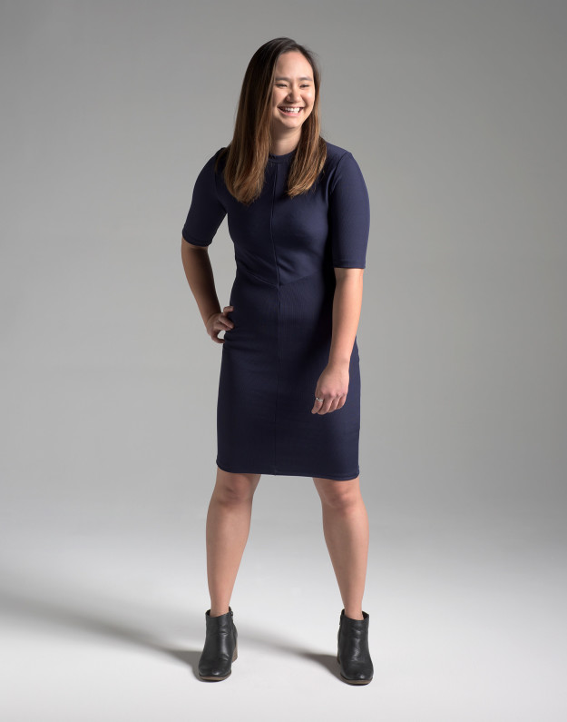 Kristin dressed Niki in a sleek navy dress with elbow-length sleeves and black heeled boots.