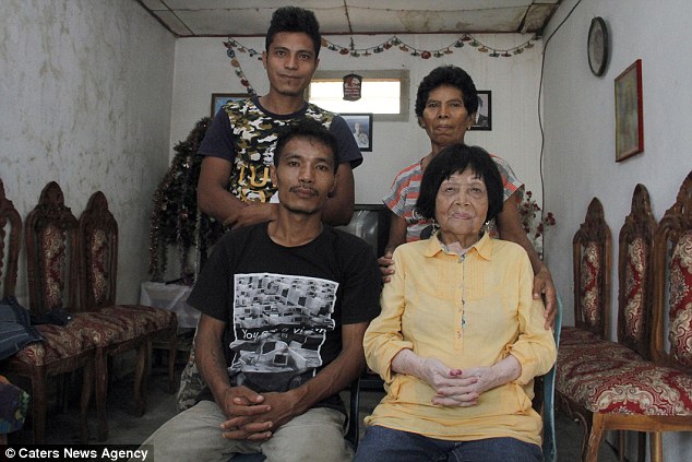 Due Indonesia being a conservative society, there were some strong opposition from their families to their relationship. But the lovers eventually won over their families with their determination and loyalty for each other. Pictured above, Dandel and Potu pose with Dandel's mother, Magdalena (back right) and brother, Oscar (back left)