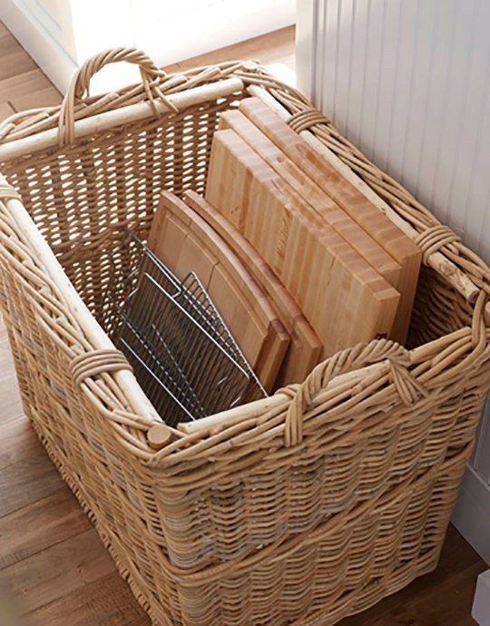 Keep cutting boards and racks in tall baskets.