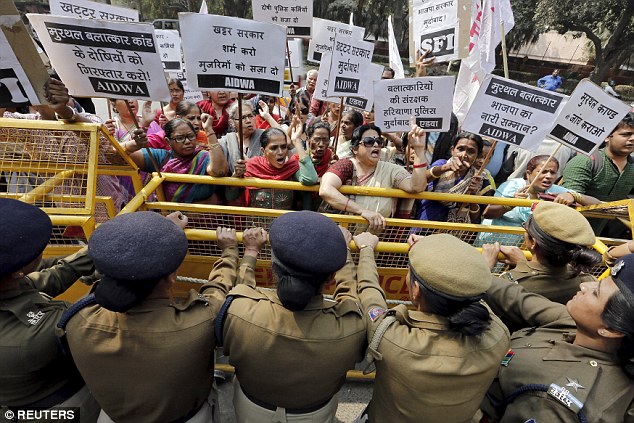 Medics said the 24-year-old, named as Rachna Sisodia, had died of a lung infection at Sharda hospital in Greater Noida, in northern India's Uttar Pradesh state. Indian women's rights campaigners are pictured during a demonstration last year
