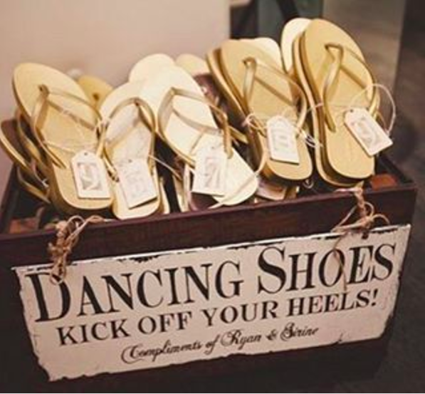 This box of sandals at a wedding that solves the "I want to wear heels but I also want to dance" quandary.