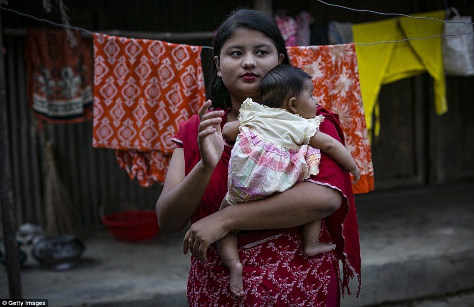 Young Bangledeshi mother Meghla, 17, married her 30-year-old husband when she was just 15. Her father forged her birth certificate so she could marry