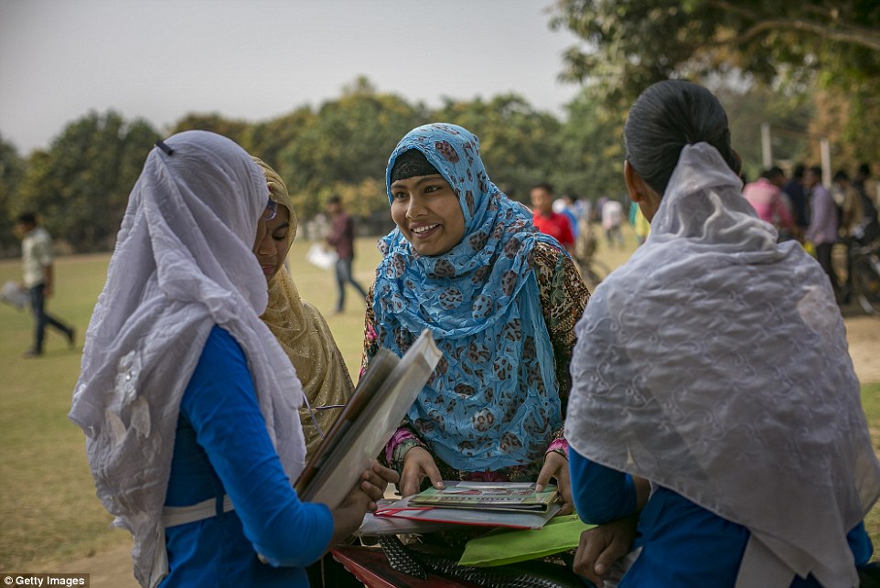  Rani (blue scarf) chats with friends before taking an exam. She says: 'I lost faith in men. Men can love women but they're not capable of respecting women.'