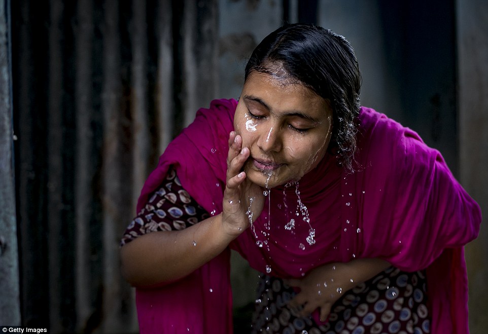The student washes her face. 'For our society for girls to leave the house and talk to boys, it's unacceptable,' she says